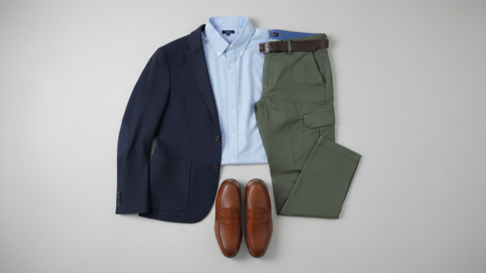 Olive cargo pants styled with blue button-down, navy blazer, and brown loafers.